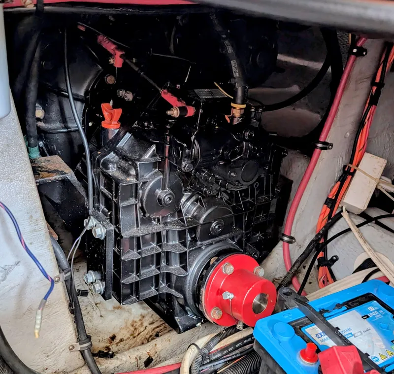 Slide: The Image of Engine compartment of a 1999 Silverton 351 Sedan Cruiser with visible wiring and battery. - 21