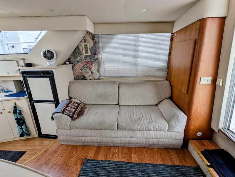 Slide: The Image of Interior of 1999 Silverton 351 Sedan Cruiser with sofa and kitchenette. - 23