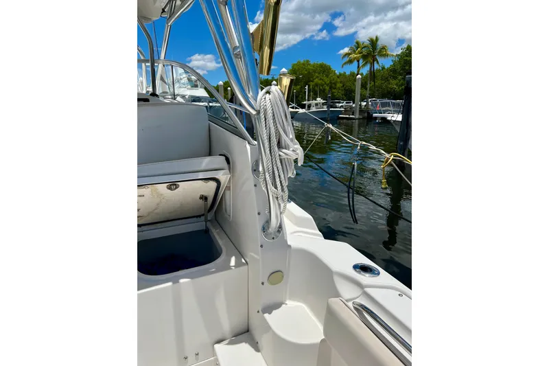 Slide: The Image of 2006 Seaswirl Striper 2901 Walkaround O/B docked, featuring deck details and marina view. - 10