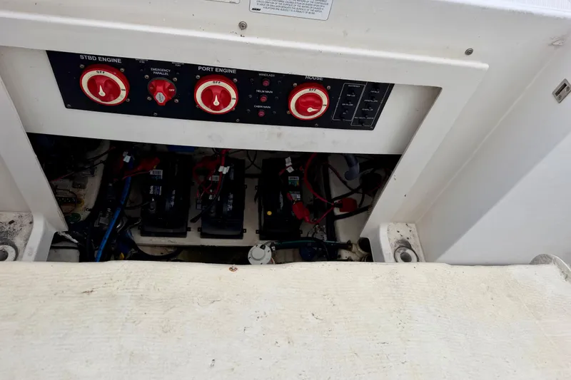 Slide: The Image of 2006 Seaswirl Striper 2901 Walkaround O/B engine control panel and battery compartment. - 28