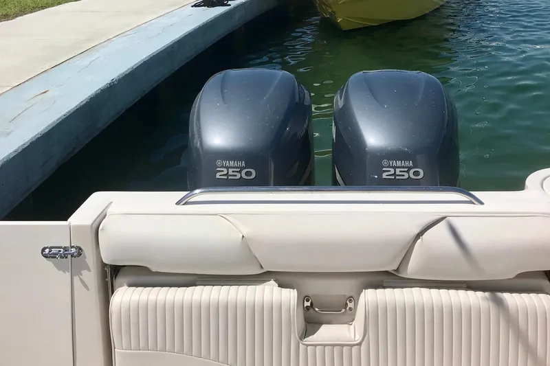 Slide: The Image of 2006 Seaswirl Striper 2901 Walkaround with twin Yamaha 250 engines at dock. - 3