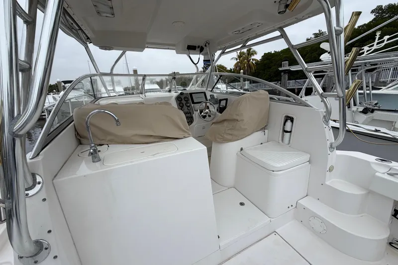 Slide: The Image of 2006 Seaswirl Striper 2901 Walkaround O/B boat interior with helm and seating area. - 5