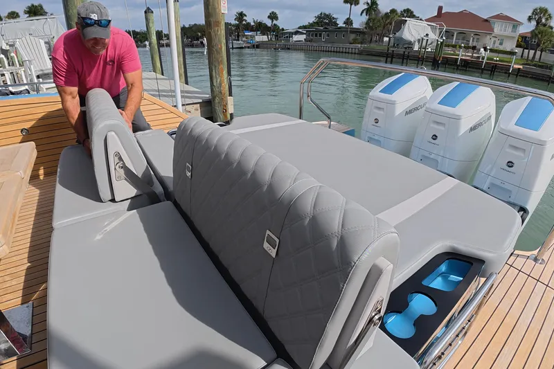 Slide: The Image of 2025 Schaefer V44 yacht with luxurious seating and powerful Mercury outboard engines. - 12