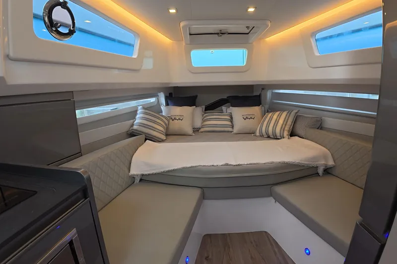 Slide: The Image of Luxurious interior of 2025 Schaefer V44 yacht with cozy seating and modern design. - 13