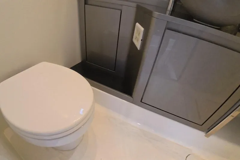 Slide: The Image of Modern bathroom in 2025 Schaefer V44 yacht with sleek cabinetry and toilet. - 15