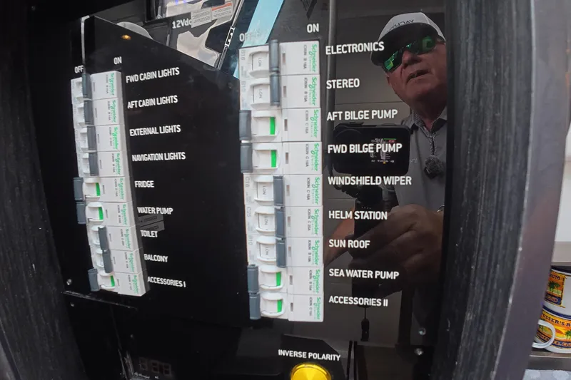 Slide: The Image of Control panel of a 2025 Schaefer V44 yacht with various labeled switches. - 19