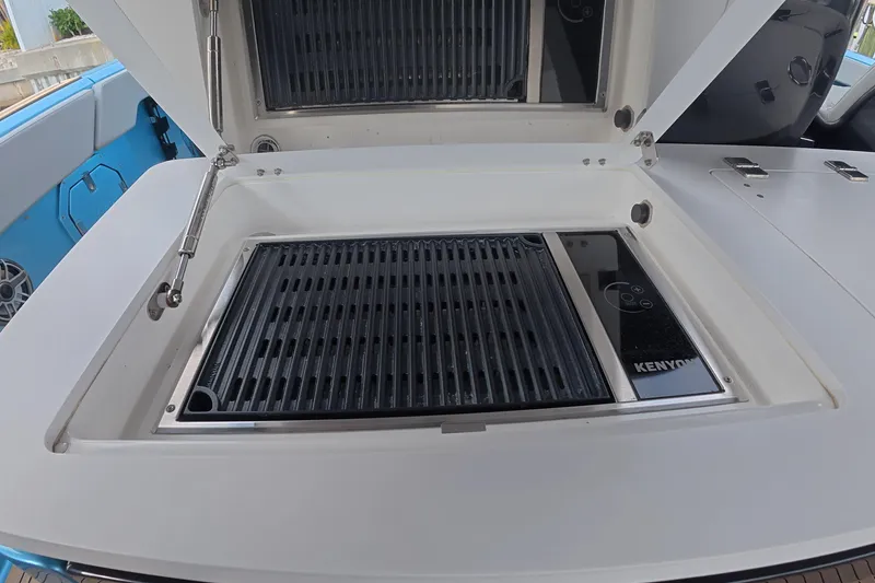 Slide: The Image of Built-in Kenyon grill on 2025 Schaefer V44 yacht deck. - 21
