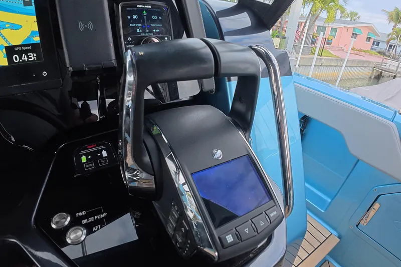 Slide: The Image of Control panel of 2025 Schaefer V44 yacht with navigation and throttle systems. - 3