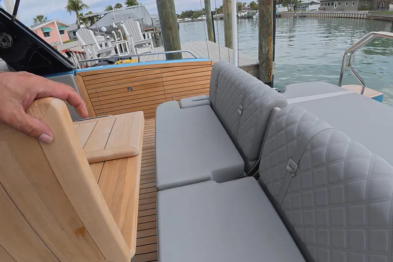 Slide: The Image of Luxury seating on Schaefer V44 yacht, 2025 model, docked by waterfront. - 30