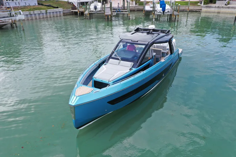 Slide: The Image of 2025 Schaefer V44 yacht in calm marina waters, showcasing sleek design and modern features. - 37