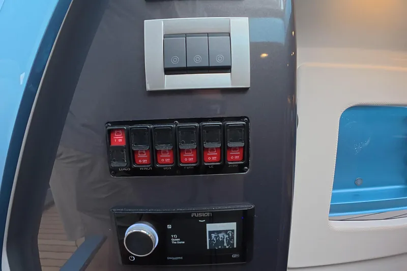 Slide: The Image of Control panel of 2025 Schaefer V44 yacht with switches and audio system. - 42