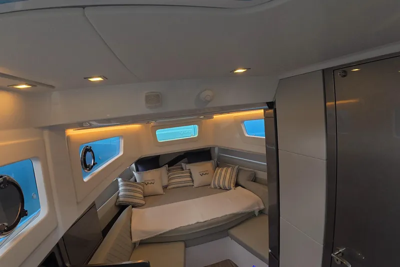 Slide: The Image of Luxurious interior of 2025 Schaefer V44 yacht with cozy seating and ambient lighting. - 43