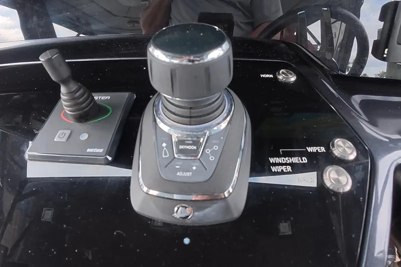Slide: The Image of Control panel of 2025 Schaefer V44 yacht with joystick and wiper buttons. - 5