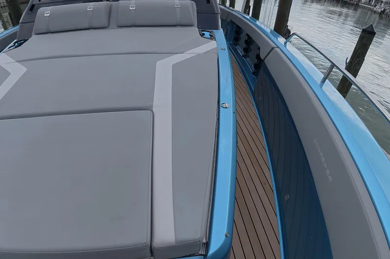 Slide: The Image of 2025 Schaefer V44 yacht with sleek deck design and luxurious seating. - 8