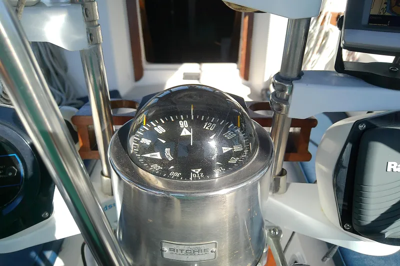 Slide: The Image of Compass on 1988 Pearson 36-2 sailboat, featuring Ritchie navigation equipment. - 14