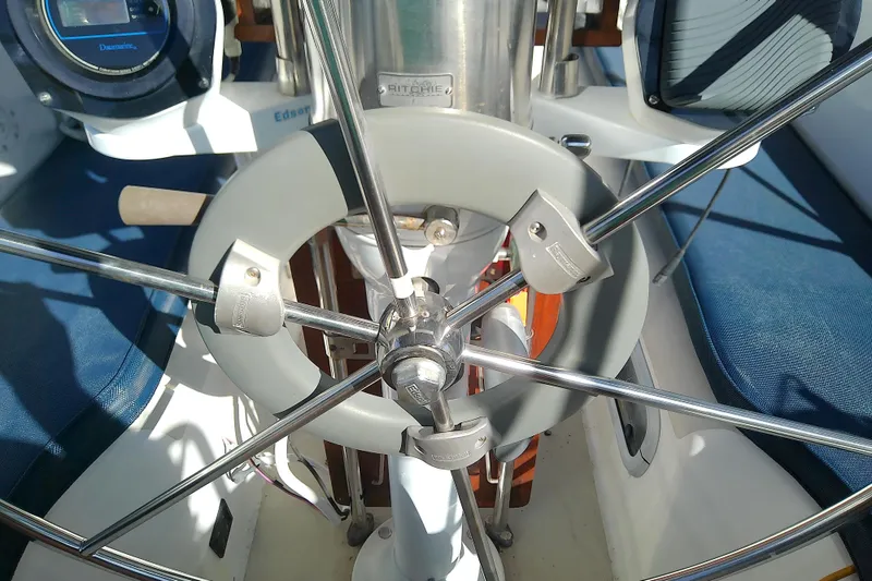 Slide: The Image of Steering wheel of a 1988 Pearson 36-2 sailboat with navigation instruments. - 15