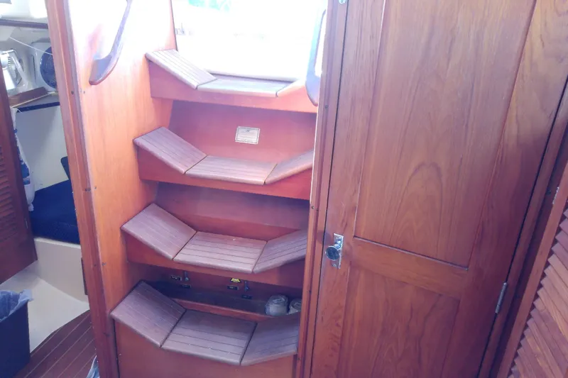Slide: The Image of Interior of 1988 Pearson 36-2 sailboat with wooden steps and cabinetry. - 49