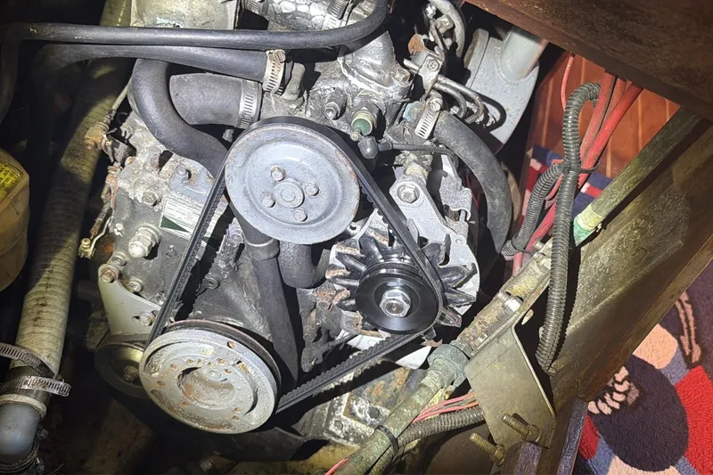 Slide: The Image of Engine compartment of a 1988 Pearson 36-2 sailboat, showing belts and pulleys. - 50