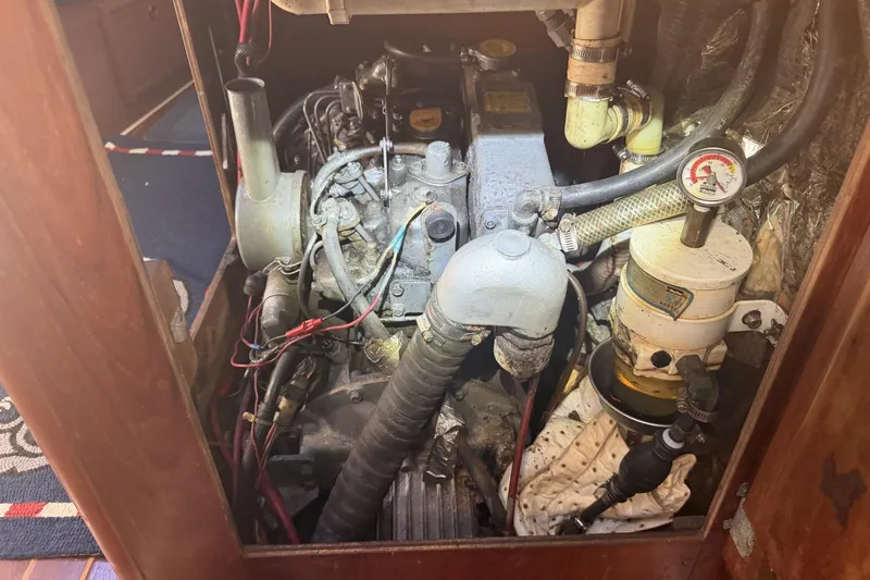 Slide: The Image of Engine compartment of a 1988 Pearson 36-2 sailboat, showing detailed mechanical components. - 51