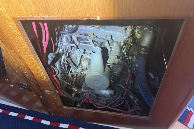 Slide: The Image of Engine compartment of a 1988 Pearson 36-2 sailboat, showing wiring and components. - 52