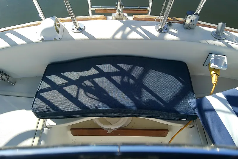 Slide: The Image of Cockpit of 1988 Pearson 36-2 sailboat with cushioned seating and nautical equipment. - 6