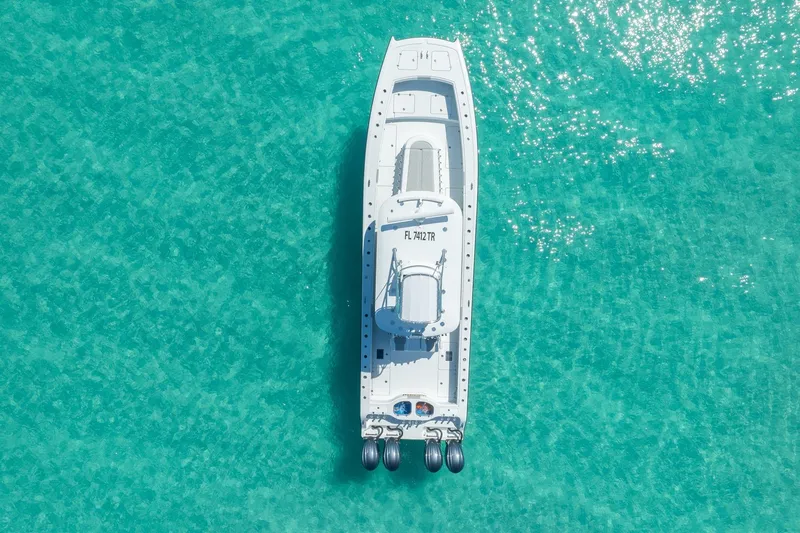 Slide: The Image of Aerial view of 2024 Freeman 42 boat on clear turquoise water. - 4