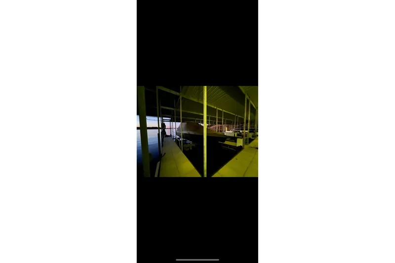 Slide: The Image of 2022 Sunsation 32 CCX boat with Mercury engine, featuring sleek deck design. - 17