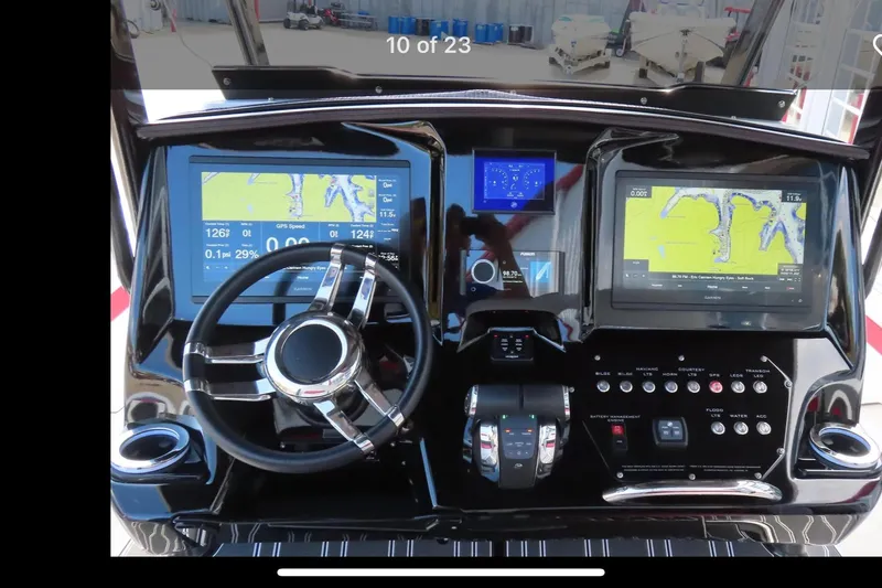 Slide: The Image of 2022 Sunsation 32 CCX boat cockpit with advanced navigation and control systems. - 5