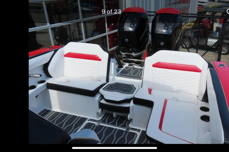 Slide: The Image of 2022 Sunsation 32 CCX boat interior with red and white seating, modern design. - 8