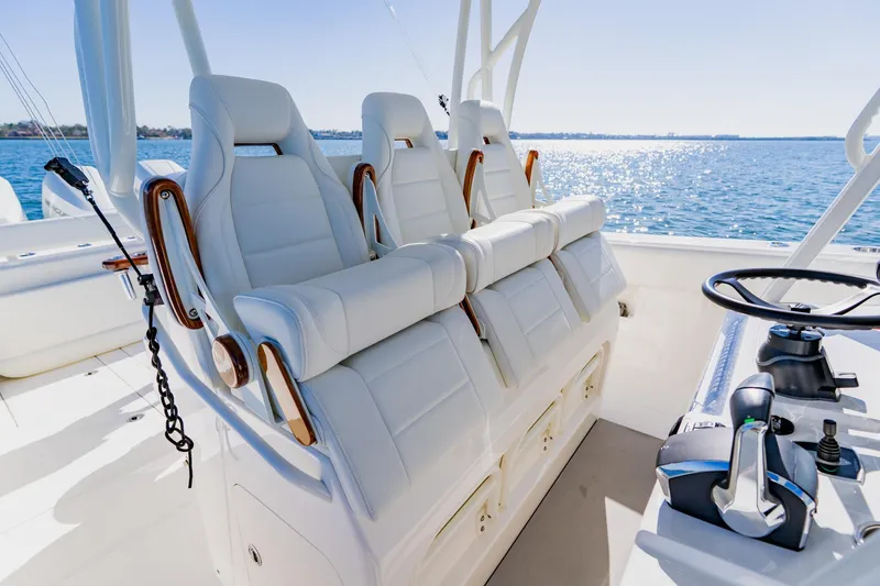Slide: The Image of 2025 SeaVee 370Z boat cockpit with advanced navigation system on a sunny day. - 20