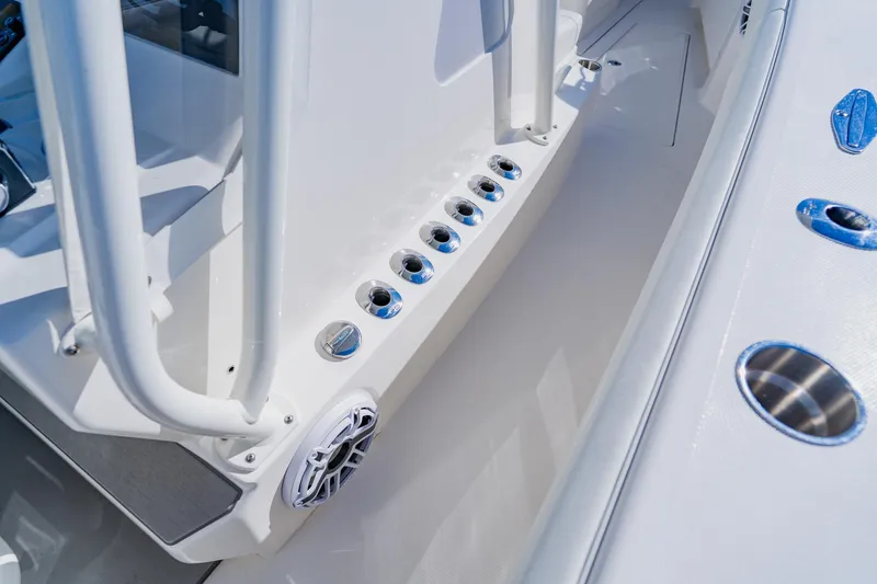 Slide: The Image of 2025 SeaVee 370Z boat interior with rod holders and speaker detail. - 24