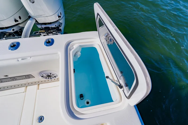 Slide: The Image of 2025 SeaVee 370Z boat with open livewell and powerful outboard engines. - 33
