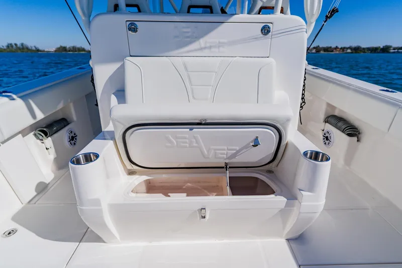 Slide: The Image of 2025 SeaVee 370Z boat interior with open storage compartment and sleek design. - 40