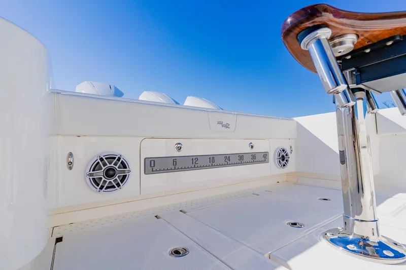 Slide: The Image of Storage compartments on a 2025 SeaVee 370Z boat, featuring organized tackle boxes and drawers. - 45