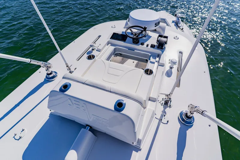 Slide: The Image of 2025 SeaVee 370Z boat helm with modern controls and seating on open water. - 49