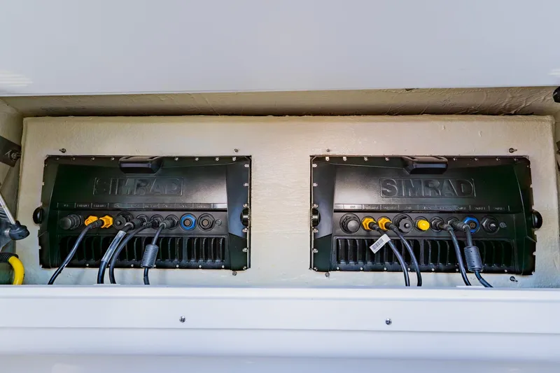 Slide: The Image of Control panel of 2025 SeaVee 370Z boat, featuring 120 VAC and 12 VDC systems. - 58