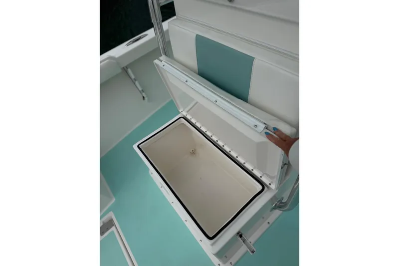 Slide: The Image of Open storage compartment on 2015 Albury Brothers 23 Center Console boat. - 10