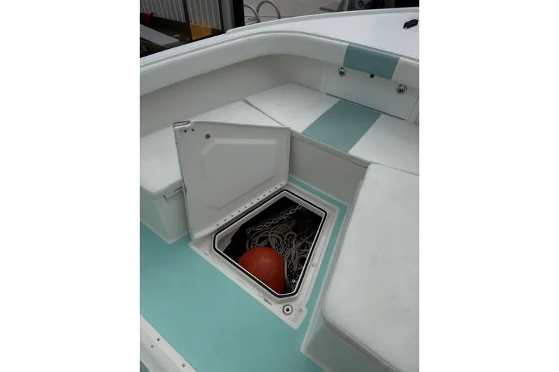 Slide: The Image of 2015 Albury Brothers 23 Center Console boat storage compartment with chain and buoy. - 12