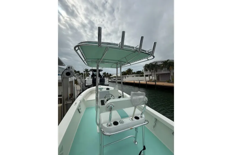 Slide: The Image of 2015 Albury Brothers 23 Center Console boat docked by waterfront homes. - 5