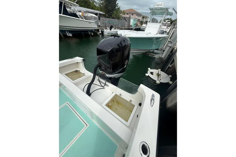 Slide: The Image of 2015 Albury Brothers 23 Center Console boat docked with outboard motor. - 8