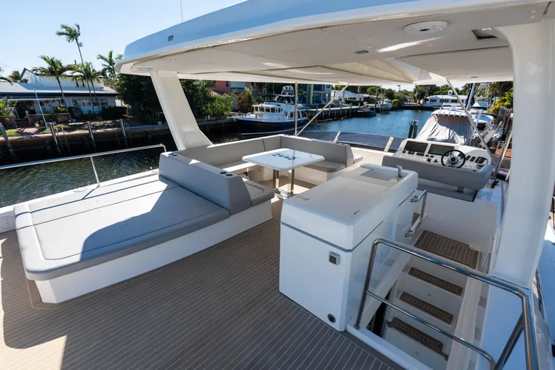 Slide: The Image of Luxurious 2021 Leopard 53 Powercat yacht with spacious deck and modern seating area. - 14