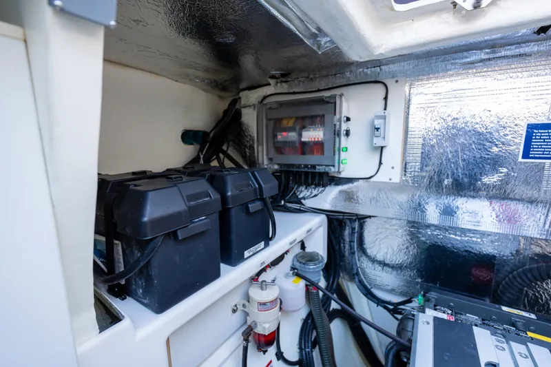 Slide: The Image of Engine room of 2021 Leopard 53 Powercat with batteries and electrical components. - 19