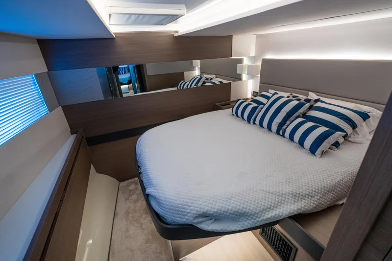 Slide: The Image of Luxurious bedroom interior of 2021 Leopard 53 Powercat yacht with striped pillows. - 25