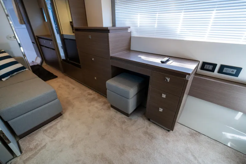 Slide: The Image of Interior of 2021 Leopard 53 Powercat with modern wood cabinetry and seating. - 29