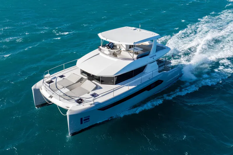 Slide: The Image of 2021 Leopard 53 Powercat cruising on open blue waters. - 3