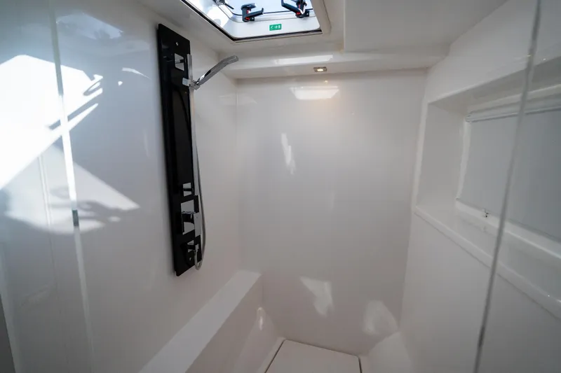 Slide: The Image of Modern shower area in 2021 Leopard 53 Powercat yacht, featuring sleek design and overhead lighting. - 33