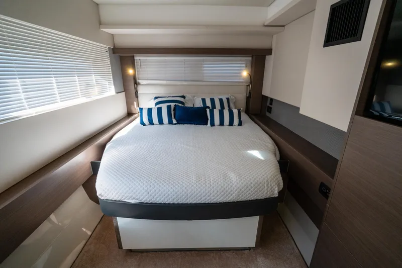 Slide: The Image of Luxurious bedroom interior of 2021 Leopard 53 Powercat with modern design and striped pillows. - 37