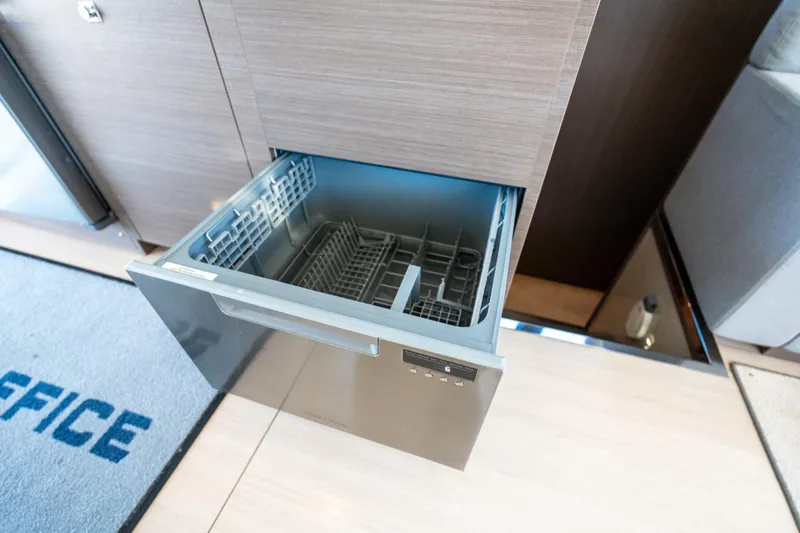 Slide: The Image of Open dishwasher drawer on 2021 Leopard 53 Powercat yacht interior. - 40