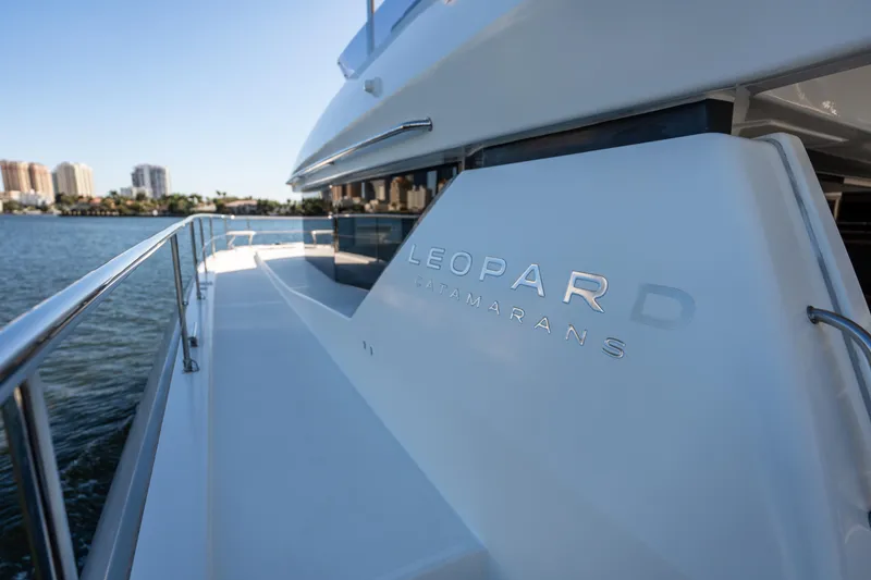 Slide: The Image of 2021 Leopard 53 Powercat yacht on water, showcasing sleek design and branding. - 42