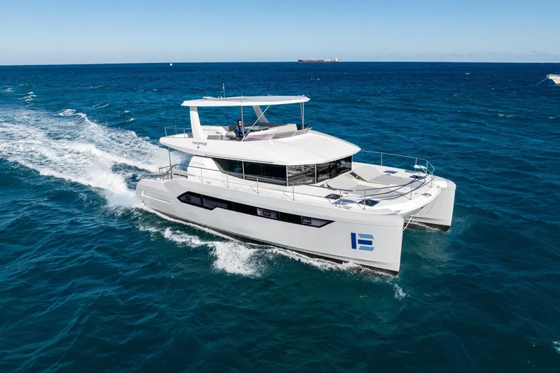 Slide: The Image of 2021 Leopard 53 Powercat cruising on open sea under clear blue sky. - 6